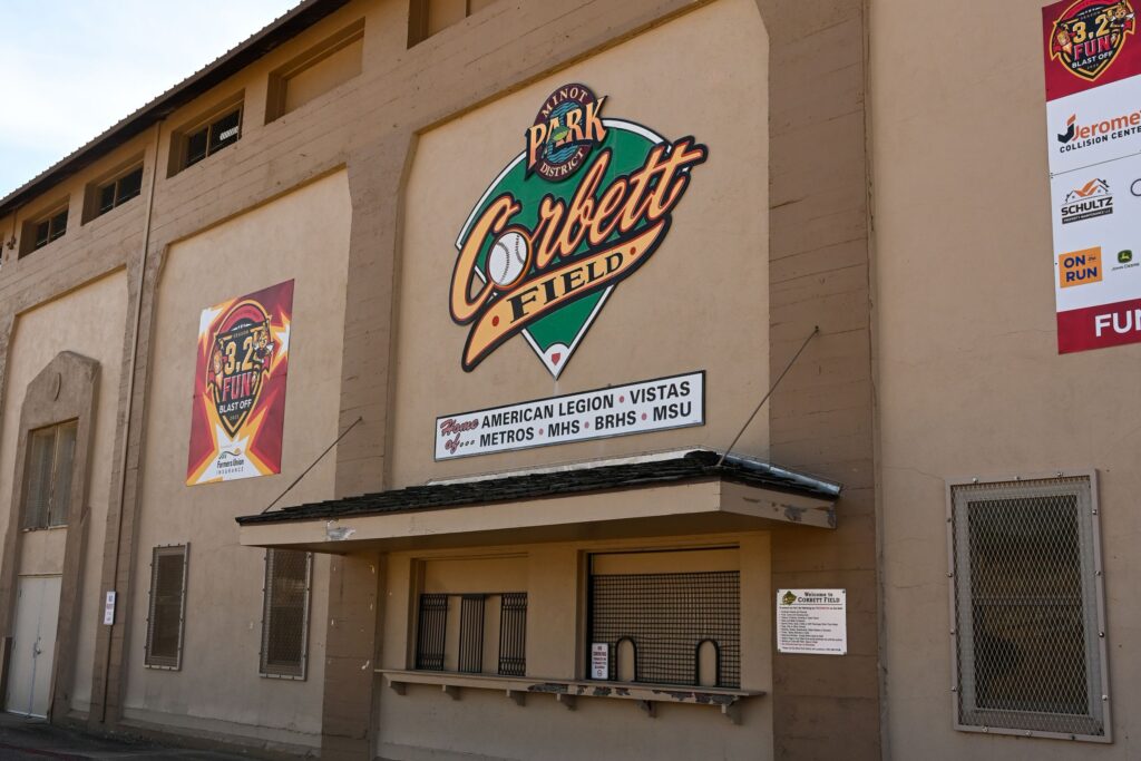 Corbett Field, a baseball and softball field with ticket booth and signs. Home of American Legion, Vistas, Metros, MHS, BRHS, and MSU.