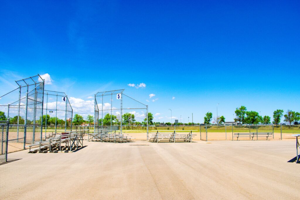 Summer day with blue skies and green grass, shot of several baseball fields at the North Hill complex in Minot, ND.